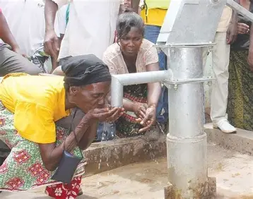 Children using a new handpump in Upper East