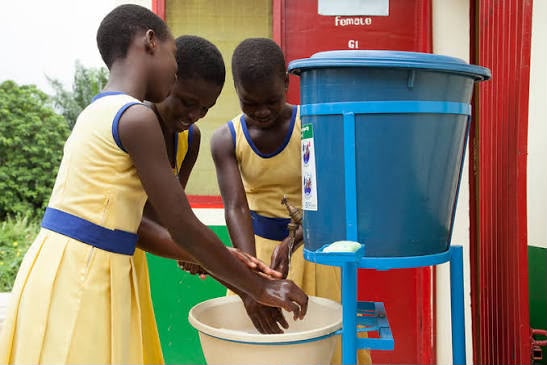 Students washing hands at school
